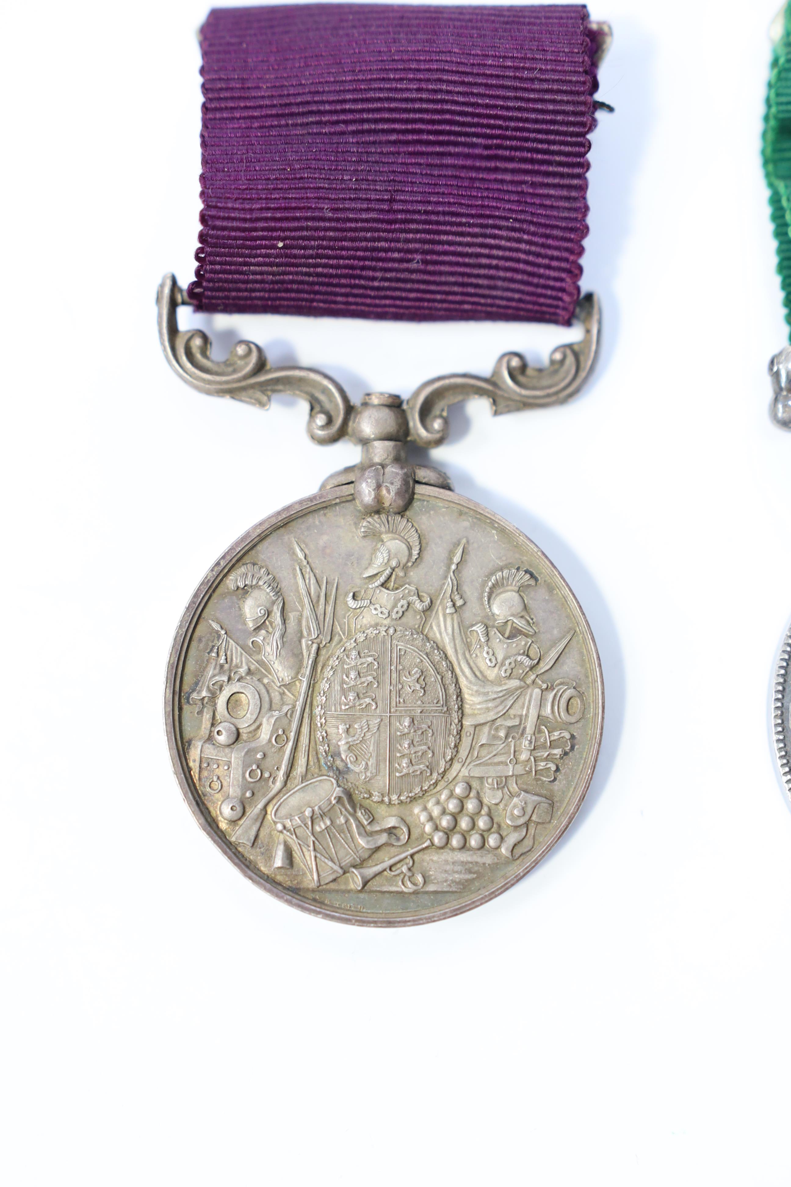 A Victorian LSGC medal to 1843 C:Sgt J.Cook. Gord. High'rs. and an unnamed Victorian Volunteer Long Service medal. Condition - fair